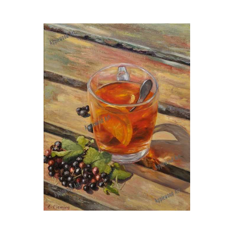 Black tea with lemon in a glass mug and blackcurrants fruit